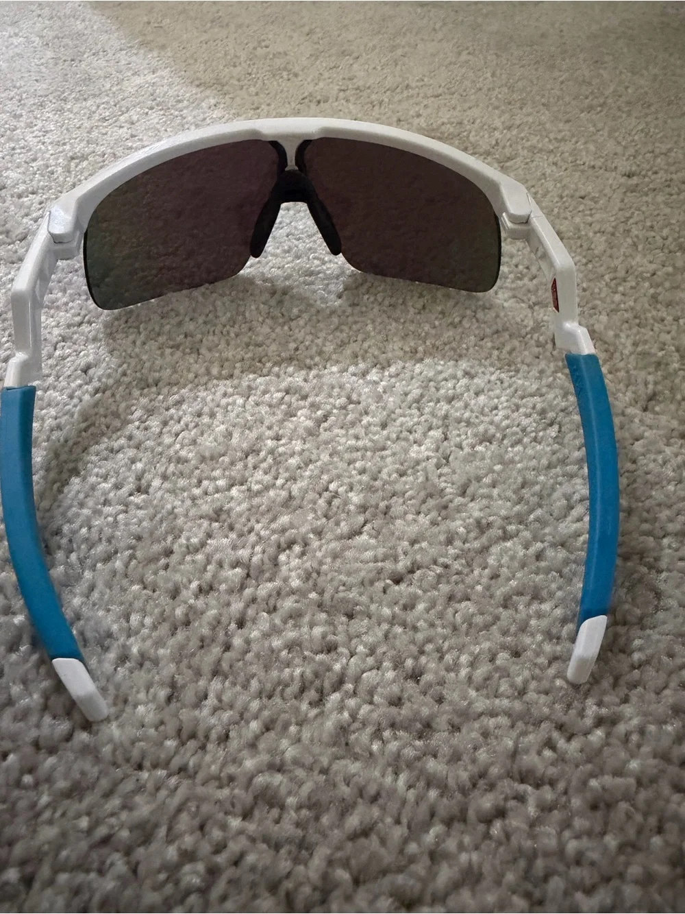Oakley White Frame Sunglasses with Blue Temples and Purple Lenses
